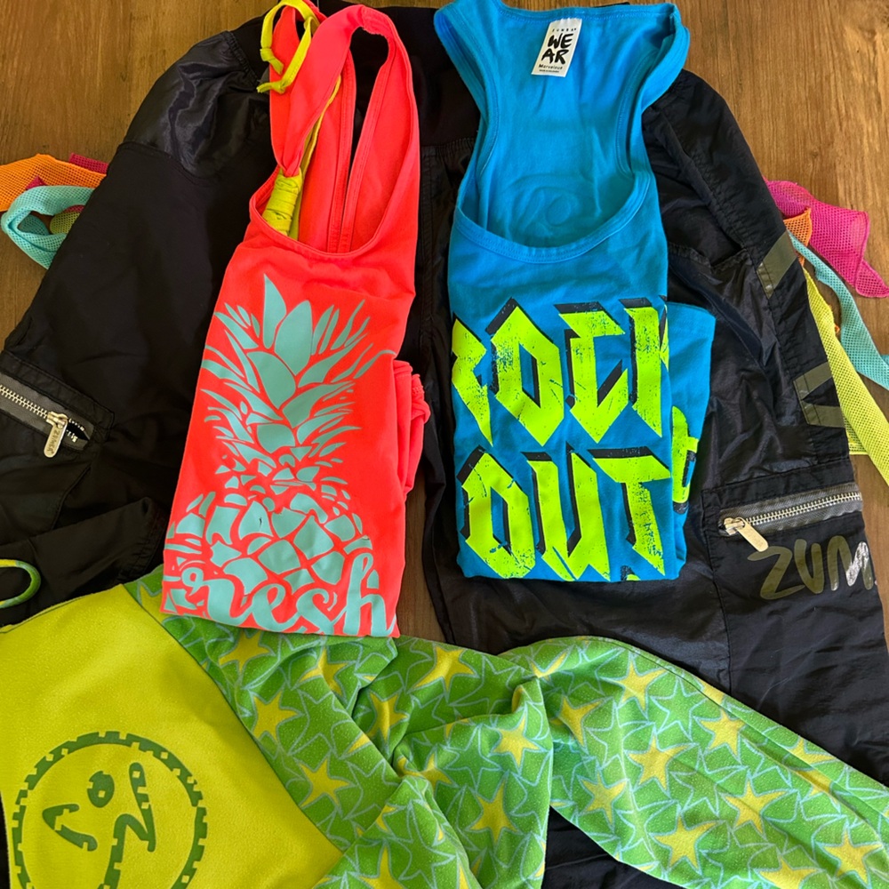 4 piece Zumba® tanks, zip up and long pants with tassels